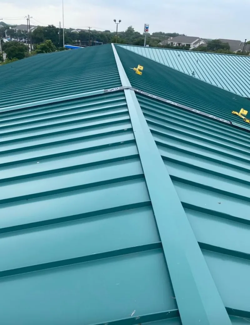 Green commercial metal roof ridge and valley for Metal Roof Repair in Skaneateles